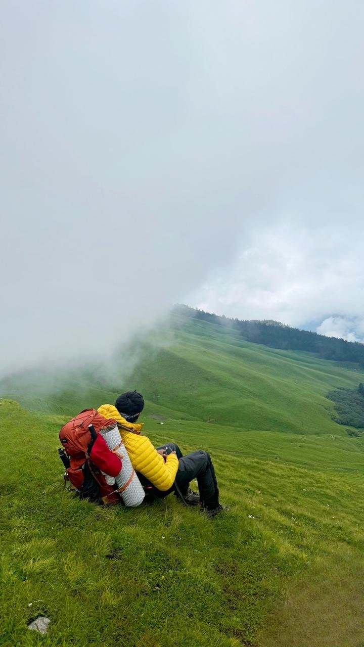 Ali Bedni Bugyal meadow covered in lush green grass with Himalayan peaks in the background this is the one of beautiful treks in india.
